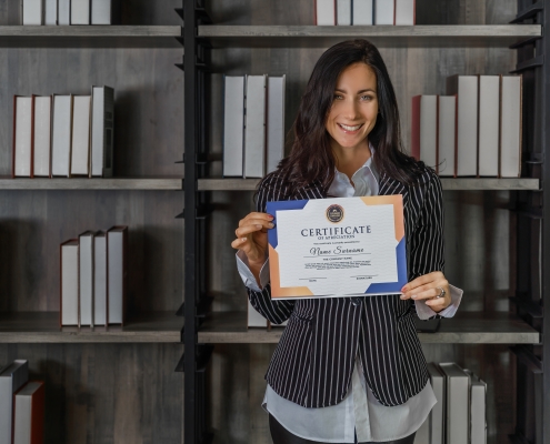 business portrait of caucasian business woman posing with certificate of appreciation recieved from business performace competition award winning